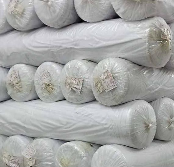 Packed fabric rolls ready for FOB Xiamen export at Ultratech warehouse